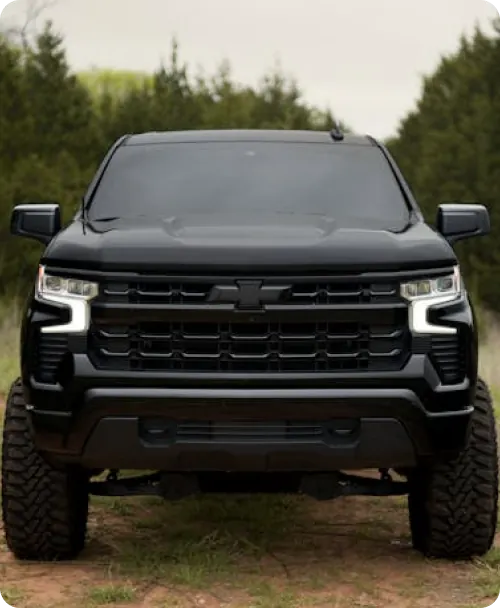 Black lifted truck with aggressive stance