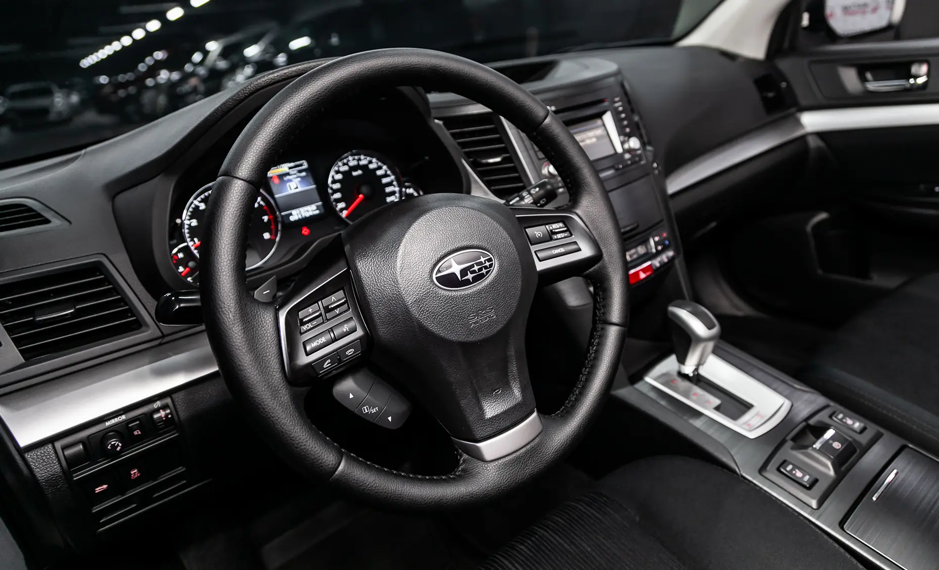 Subaru repair in Albuquerque, NM by Albuquerque Auto Repair and Tire. Image of a Subaru interior with steering wheel and dashboard, highlighting maintenance for safety and performance.