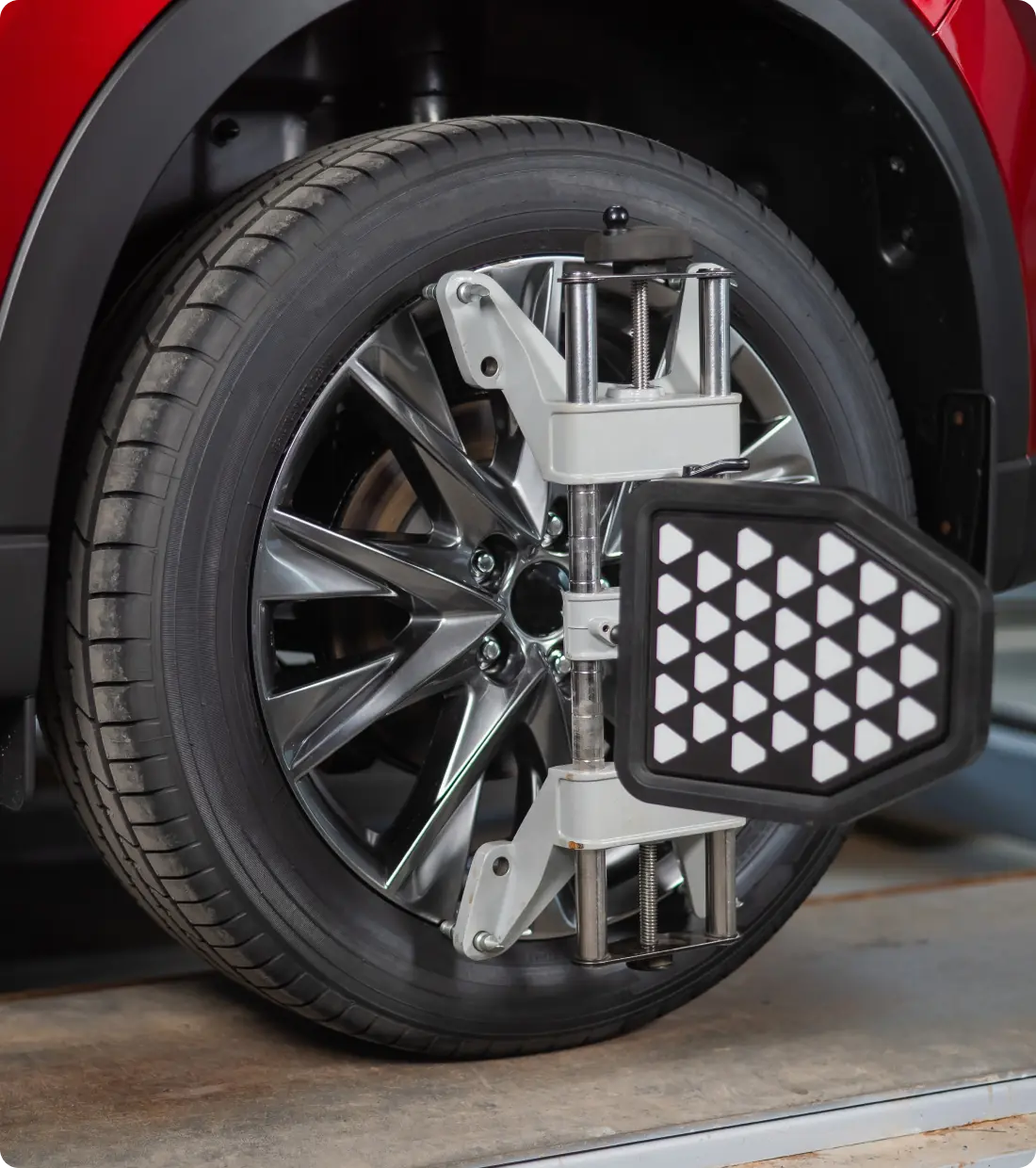 Wheel alignment equipment on tire.