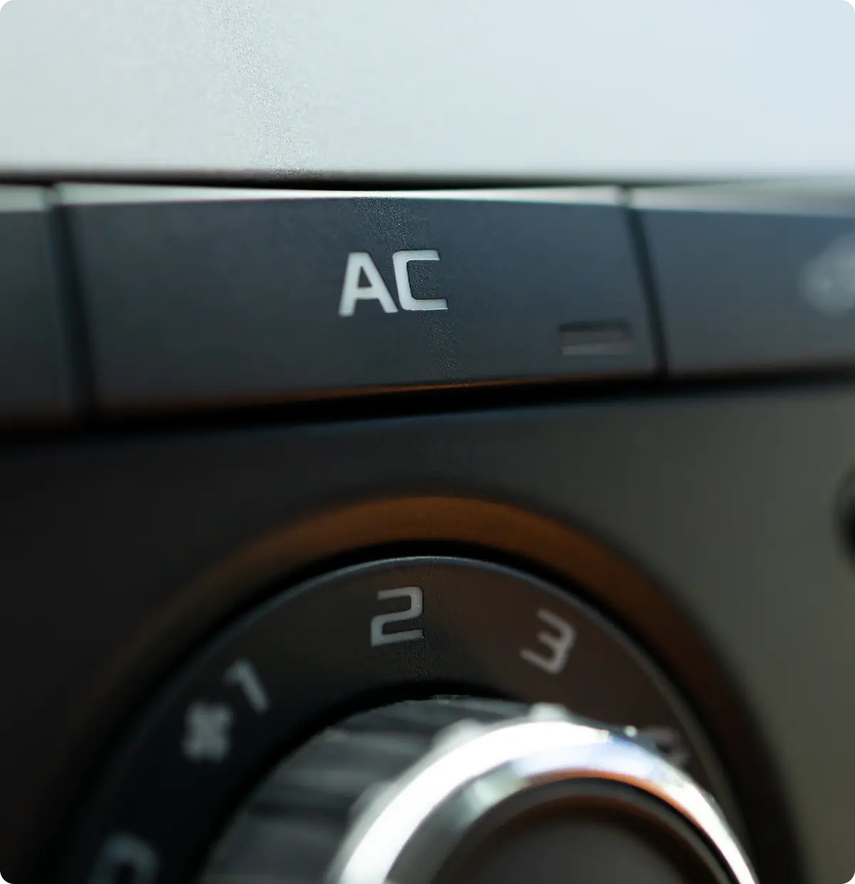 Close-up of air conditioning controls.