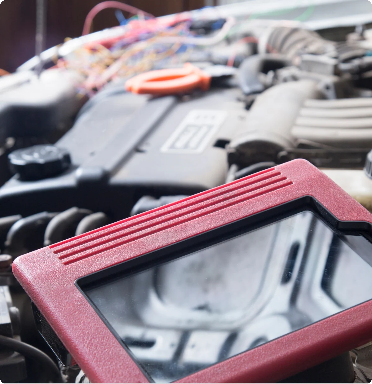 Car diagnostic tool on engine.