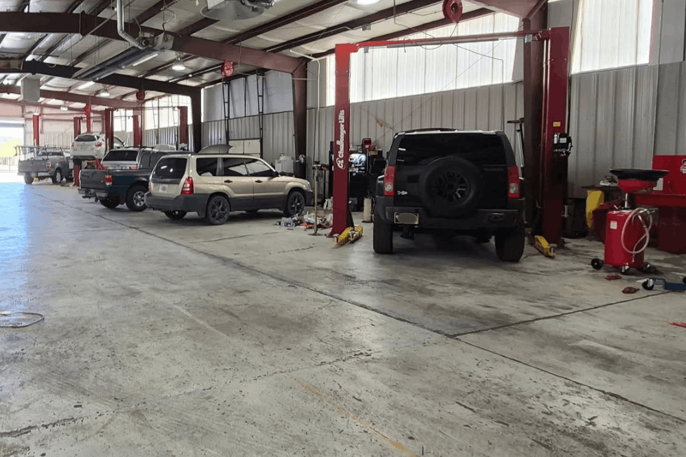 Vehicle inspection in Albuquerque, NM, at Albuquerque Auto Repair & Tire. Image showcases a spacious auto repair facility where trained technicians perform comprehensive inspections, diagnostics, and maintenance on cars, SUVs, and light trucks.